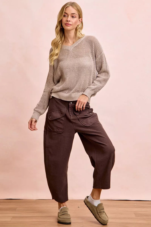Woman wearing brown BiBi Washed Terry Pants with pockets and a beige sweater in a casual outfit