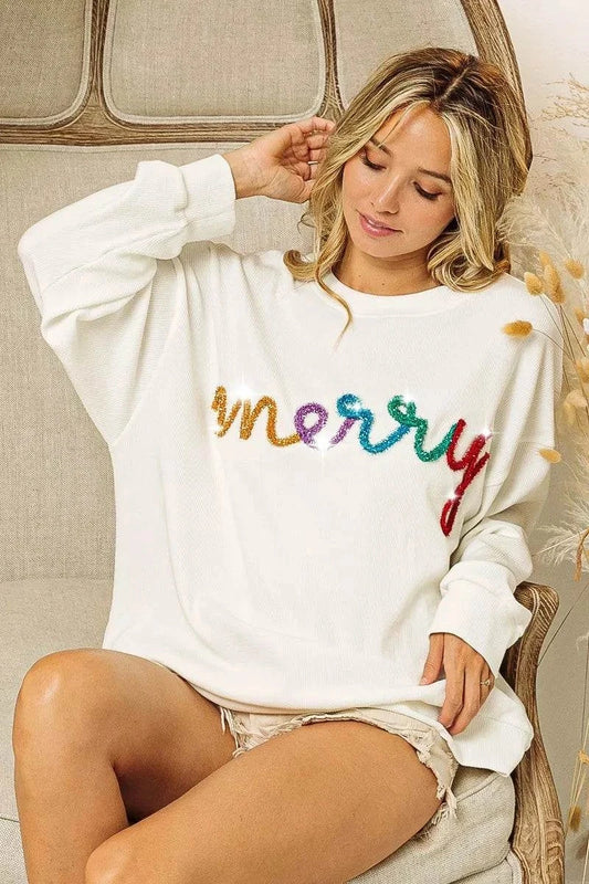 White drop shoulder sweatshirt with colorful Merry tinsel lettering and relaxed fit.