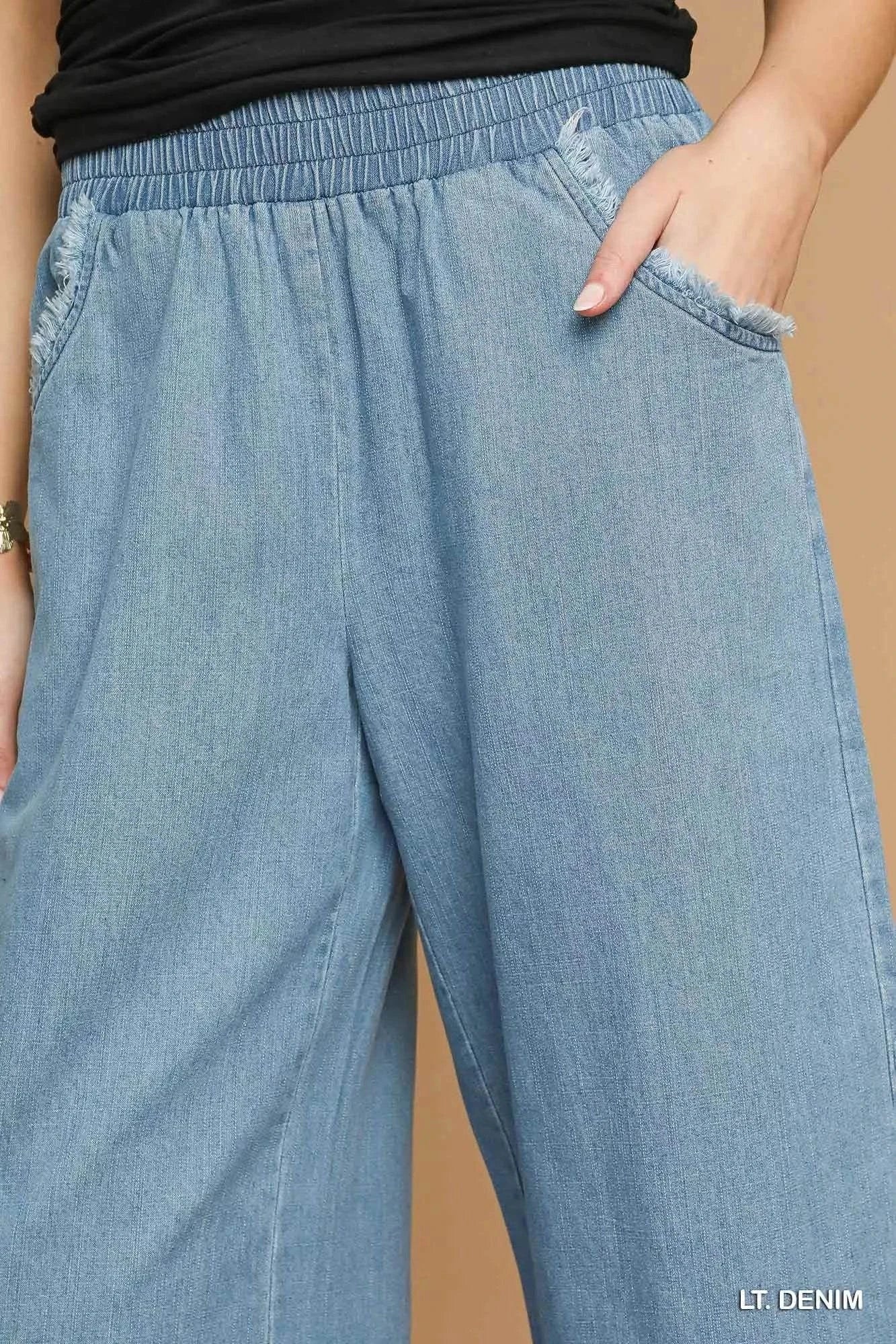 Umgee Washed Fringe Hem light denim wide leg jeans with elastic waistband and raw frayed pockets