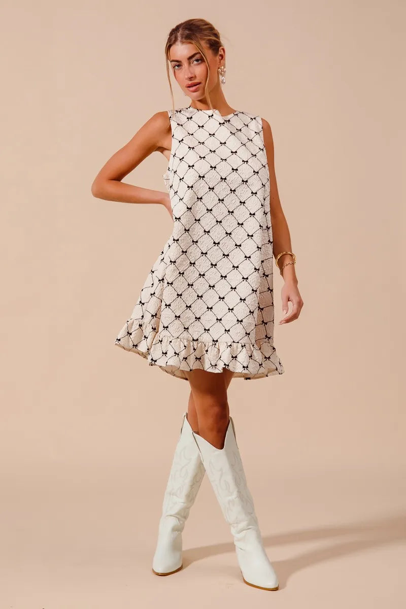 SO ME Texture Bow printed sleeveless mini dress with ruffle hem and relaxed fit in black and white