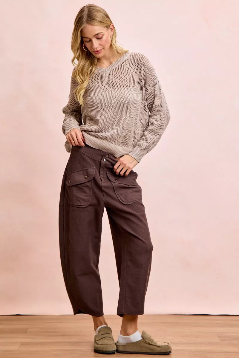 Woman wearing brown BiBi Washed Terry Pants with pockets and beige sweater in casual outfit