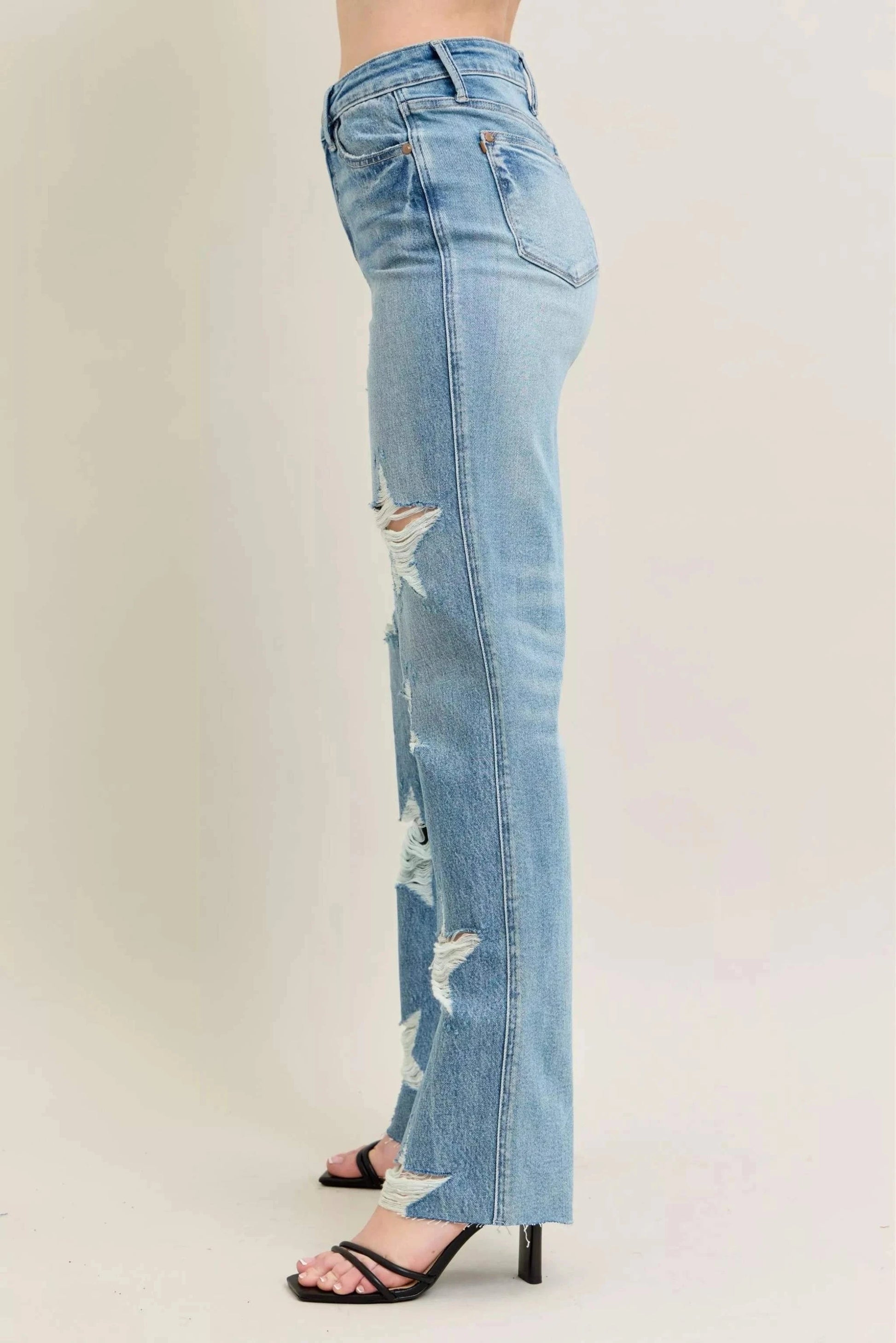 Side view of Judy Blue Plus Size 90's high waist straight jeans in light rigid denim with star-shaped distressed details