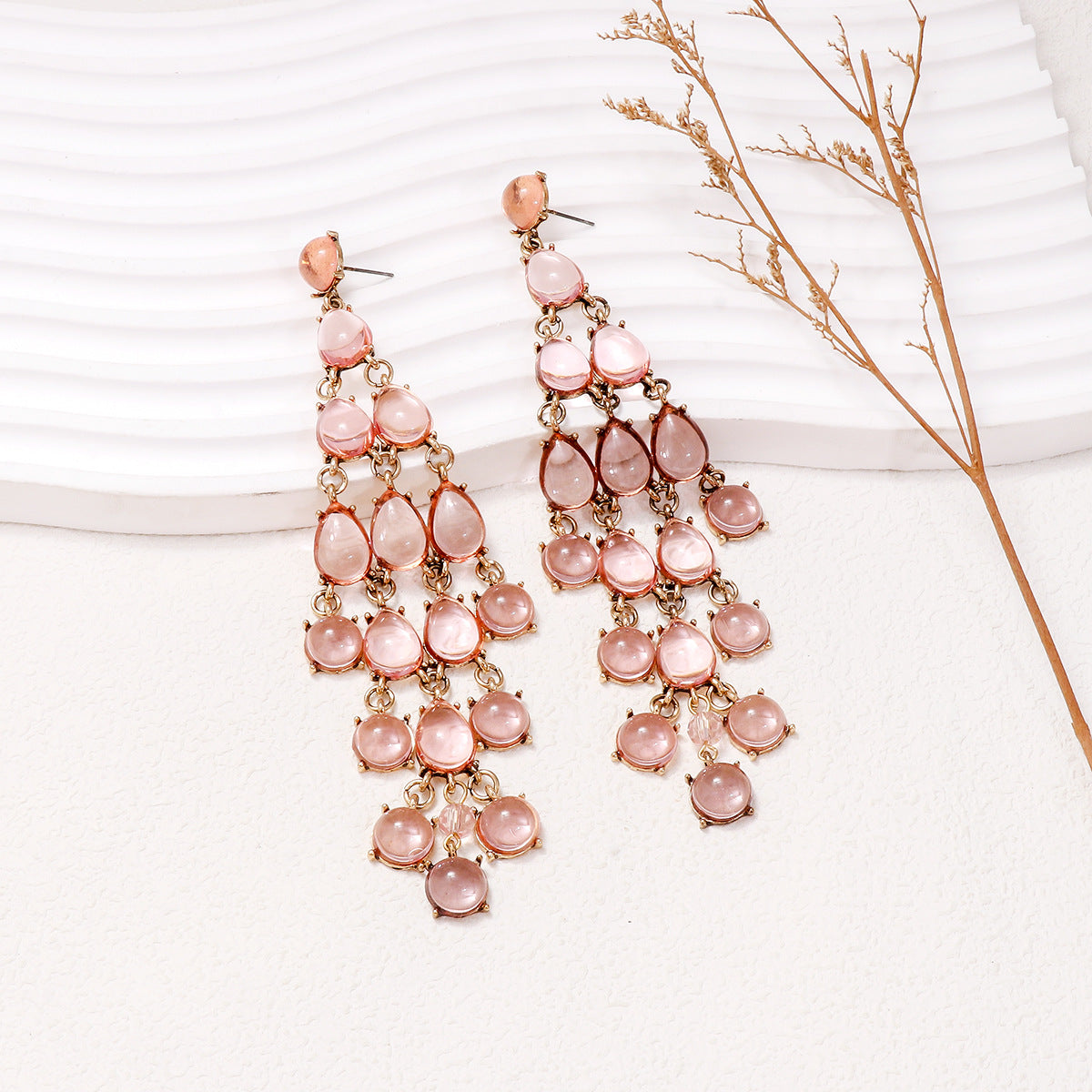 Alloy and rhinestone teardrop chandelier earrings with pink stones and gold-tone metal