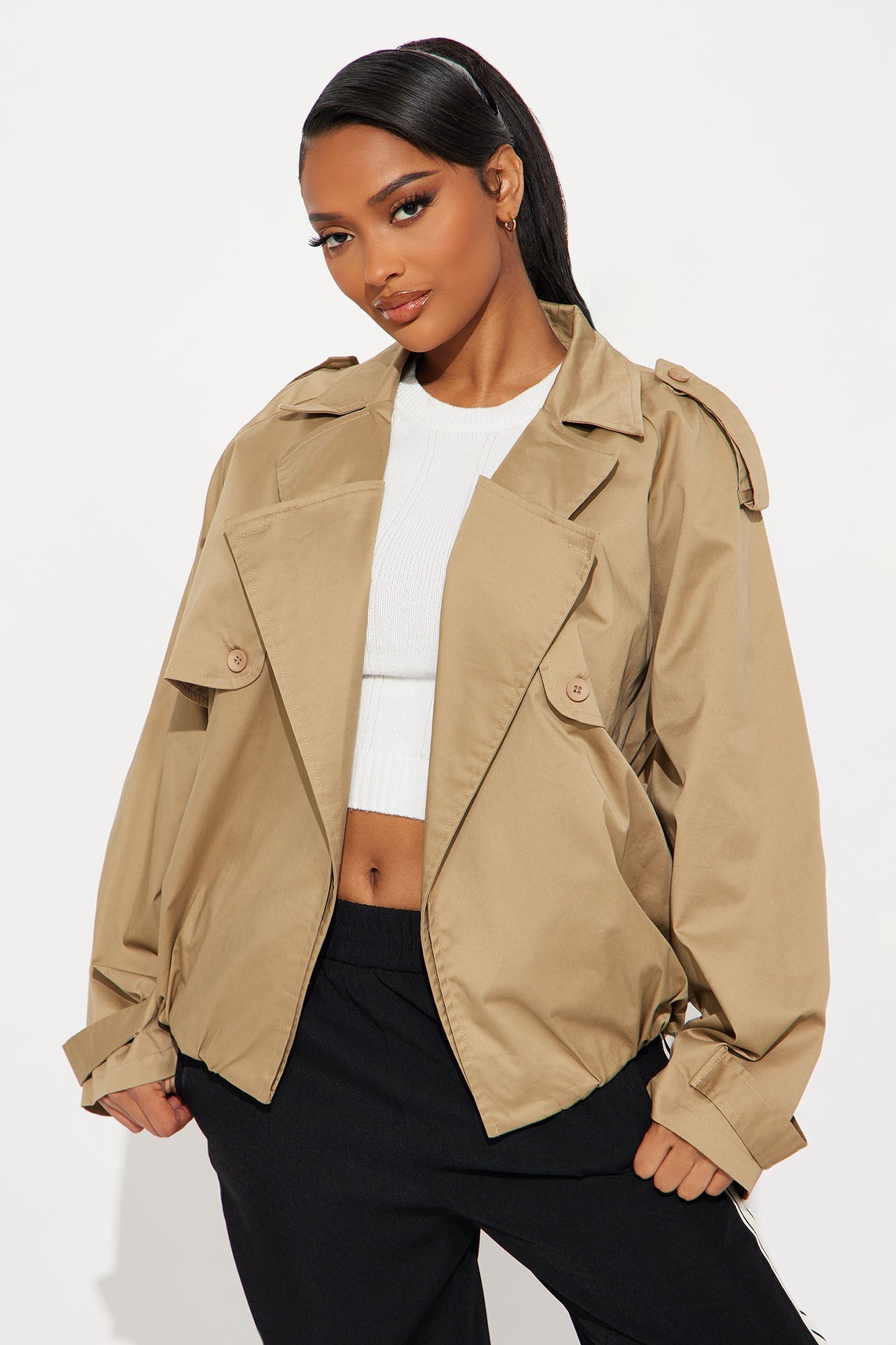 Marie Cropped Bubble Trench in taupe worn by woman with white top and black pants, stylish lightweight outerwear with cropped bubble silhouette