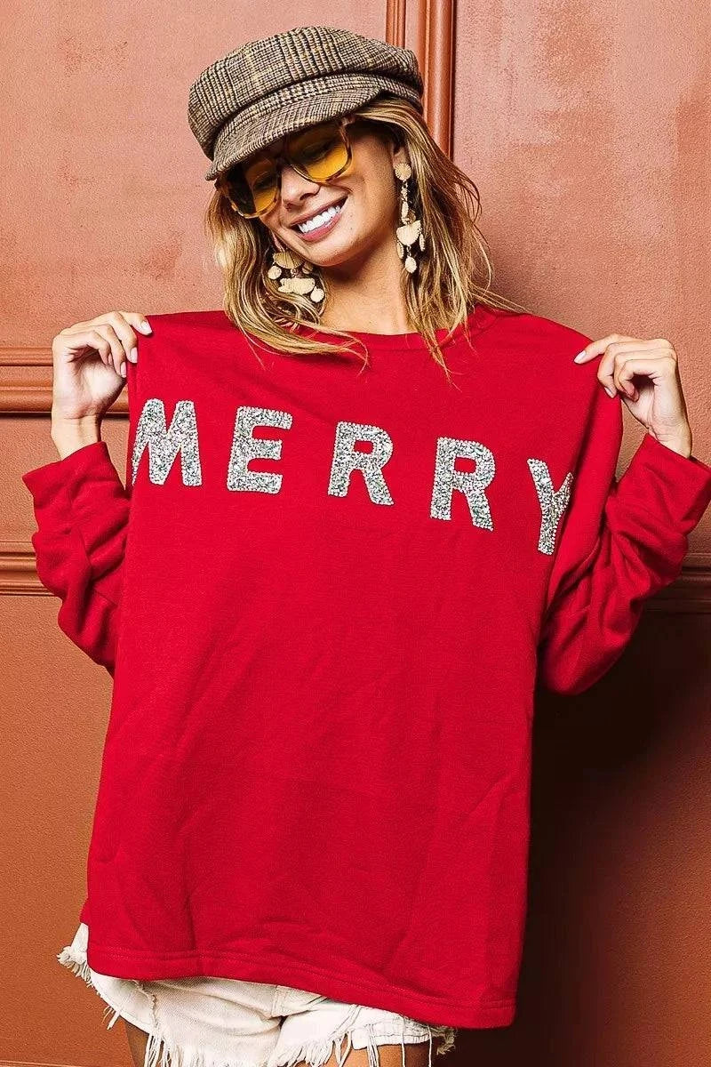 BiBi Merry Glitter Christmas Drop Shoulder TopThis Merry Glitter Christmas pullover is a festive and sparkly addition to your holiday wardrobe. The glitter detailing adds a touch of glamour and holiday cheer to BiBi Merry Glitter
