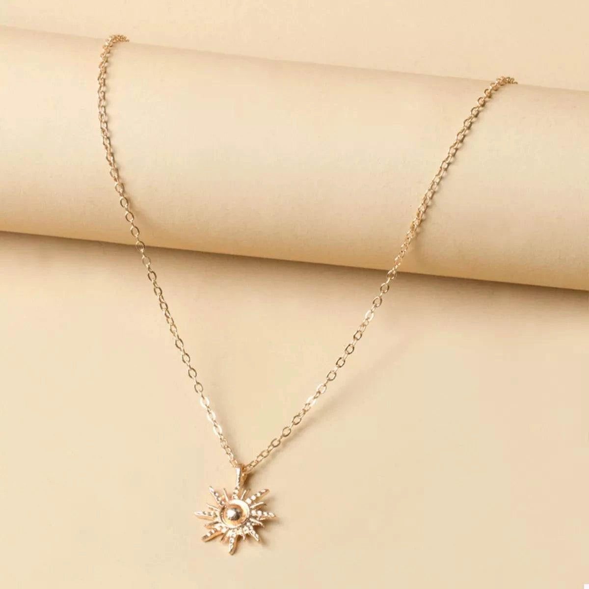 Sunburst Pendant NecklacePieces:1-piece
Material:18K Gold-Plated,Zinc alloy,Silver-plated
Care instructions:Avoid wearing during exercise, as sweat will react with the jewelry to produce silSunburst Pendant Necklace