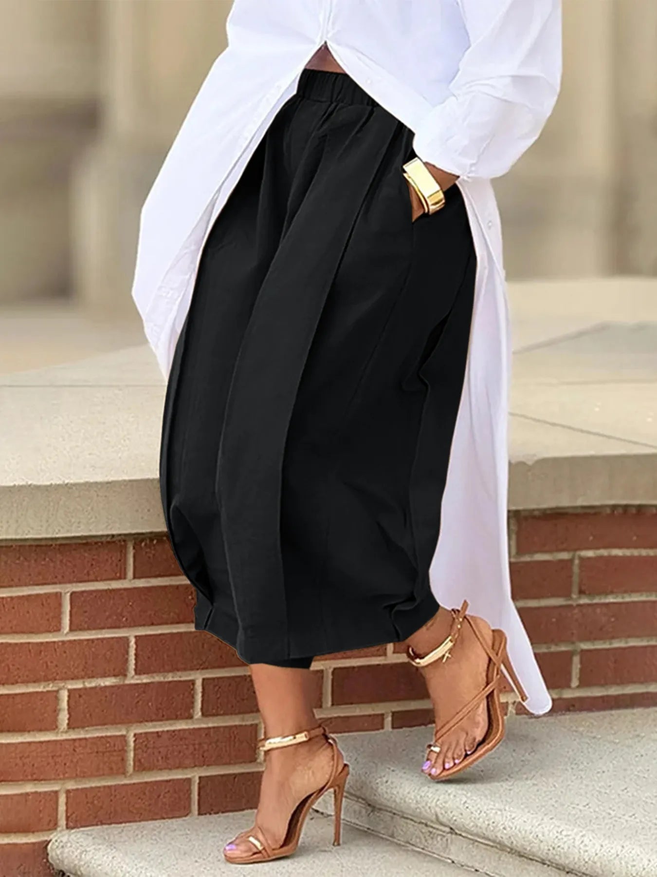 Plus Size Pleated Cropped Pants with Wide Leg Detail.