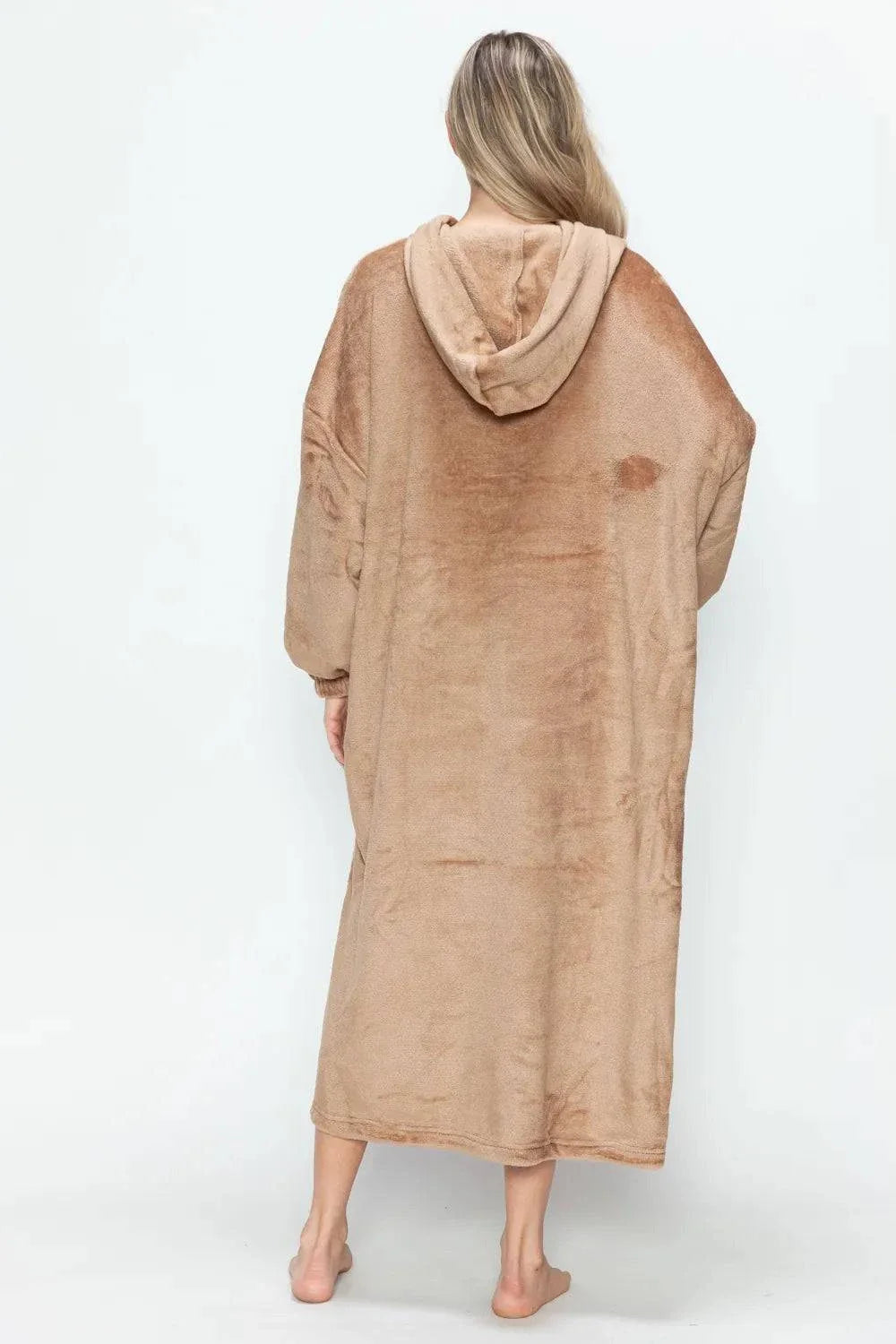 woman wearing tan hooded midi lounge dress shown from back with full-length pockets and cozy fabric