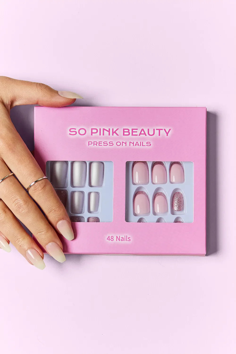 So Pink Beauty Press On Nails 2 Packs with 48-piece nails in pink packaging and hand model showing press-on nails