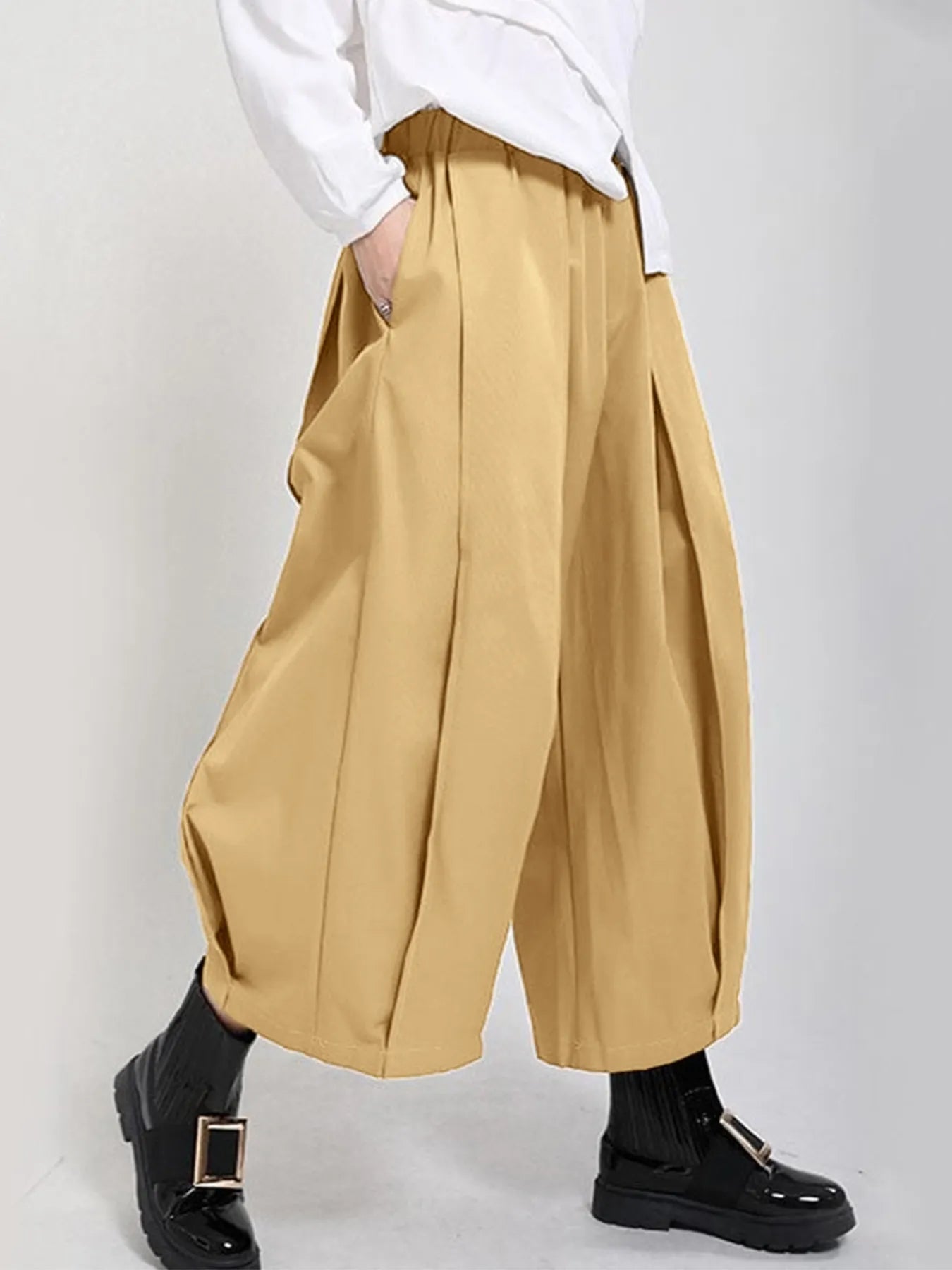 Plus Size Pleated Cropped Pants with Wide Leg Detail.