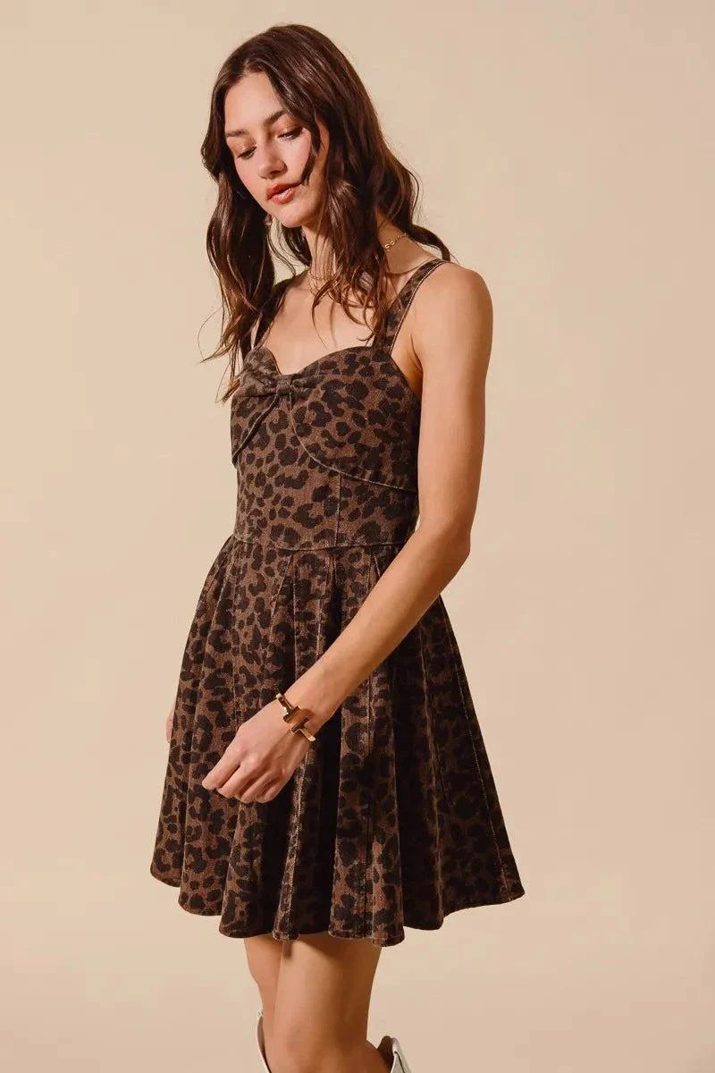 Woman wearing SO ME Mineral Washed Leopard Flare Cami Dress with adjustable straps and flare silhouette