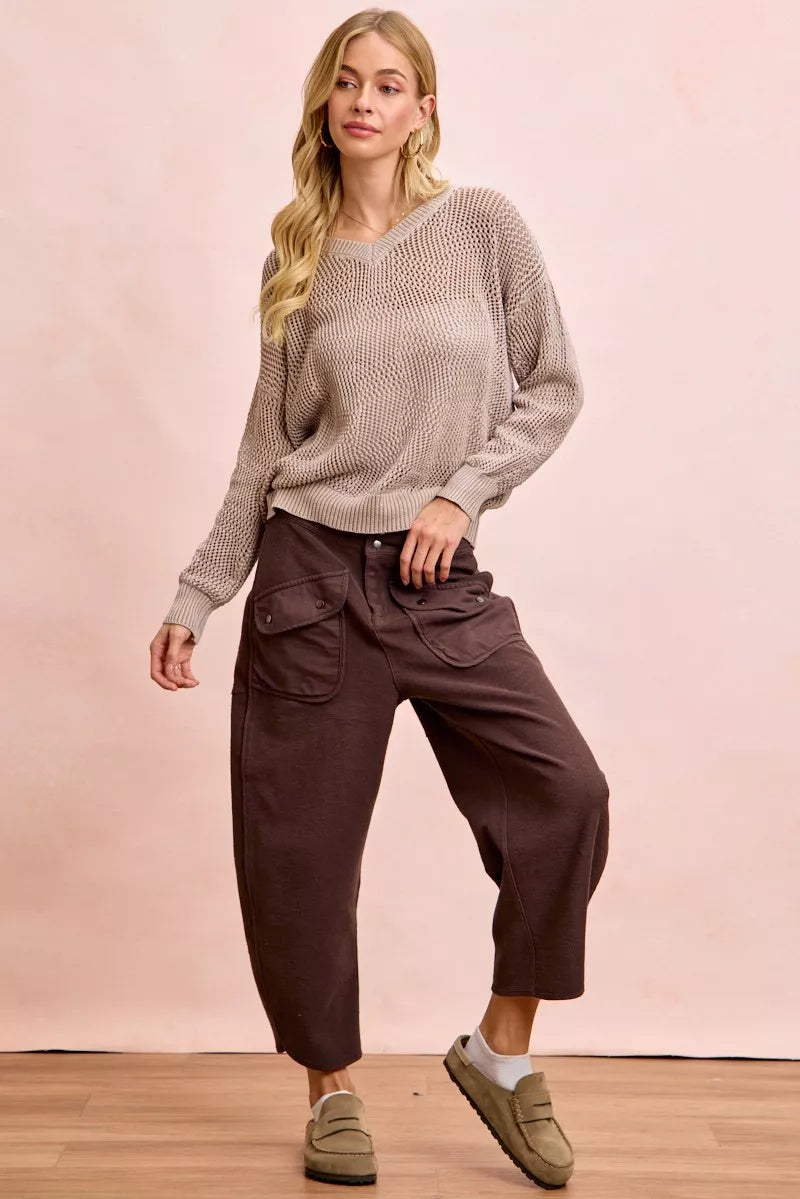 Woman wearing brown BiBi Washed Terry Pants with pockets and a beige sweater in a casual outfit