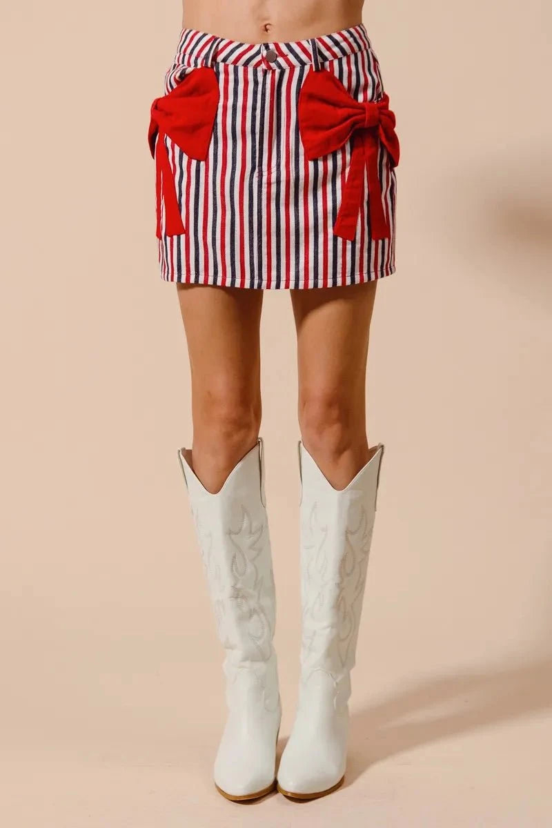 SO ME Contrast Bow Knot Pocket Fourth Of July Denim SkirtThis stylish striped denim mini skirt features a charming nautical-inspired design with bold red and white vertical stripes. Crafted from lightweight denim material,Redemption By Ashley NorthContrast Bow Knot