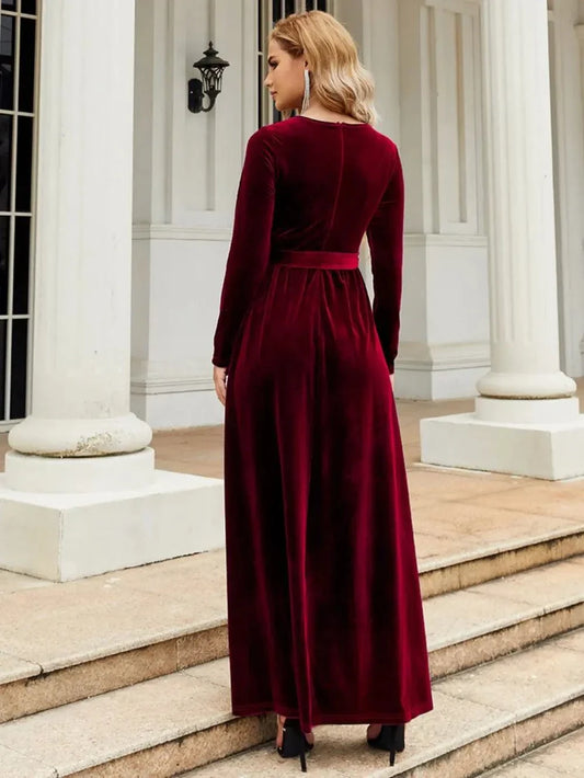 back view of burgundy tie front round neck long sleeve maxi dress on woman
