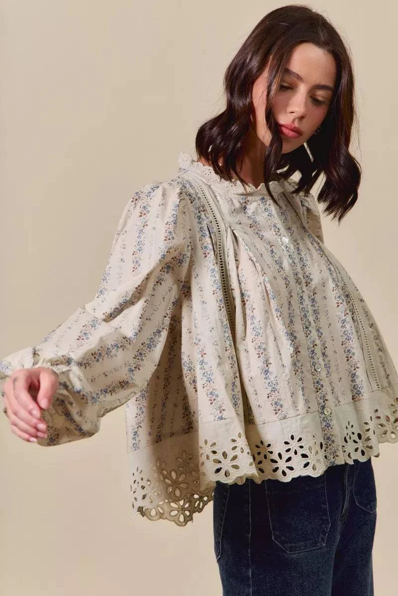 Woman wearing SO ME floral print lace button-down shirt with ruffled lace detail and eyelet hem
