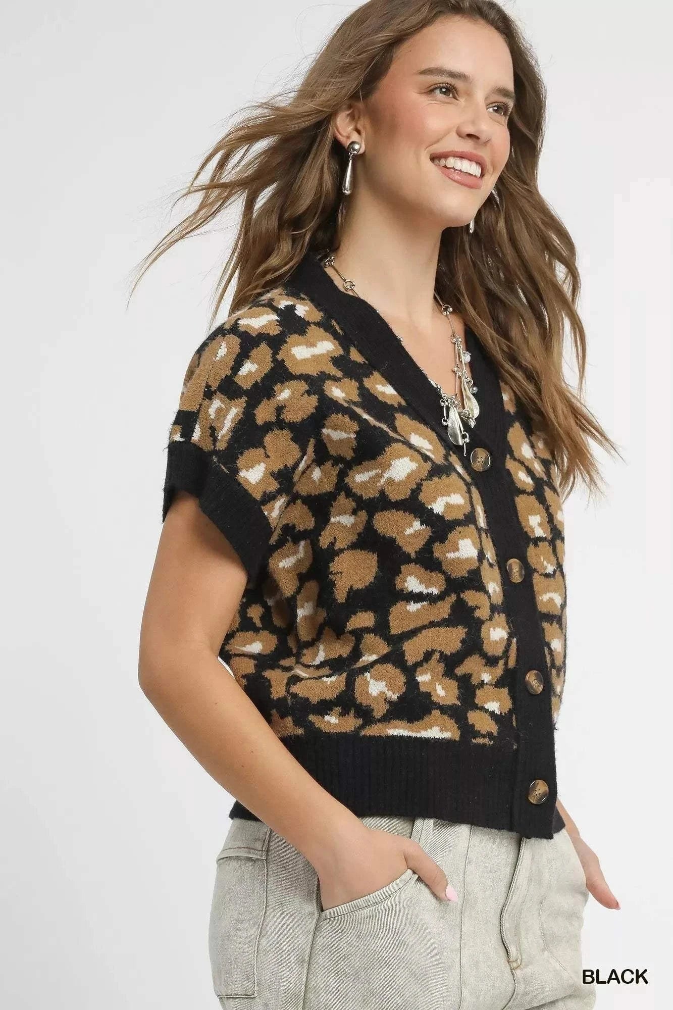 Umgee Leopard Button Down Short Sleeve CardiganThis stylish leopard print cardigan combines comfort and fashion with its eye-catching animal print pattern and classic button-up design. Made from soft knit materiaRedemption By Ashley NorthUmgee Leopard Button Down