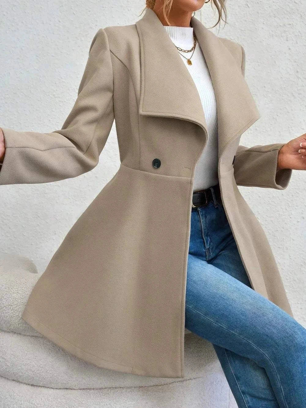 beige collared neck button up long sleeve coat with flared hem and single button closure