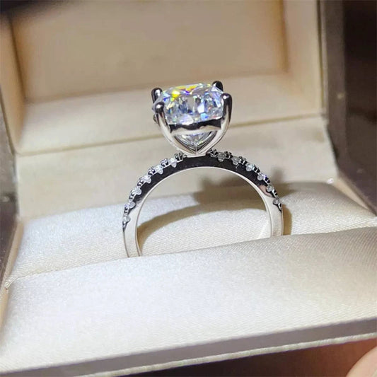 8 carat moissanite sterling silver ring with platinum plating in a jewelry box