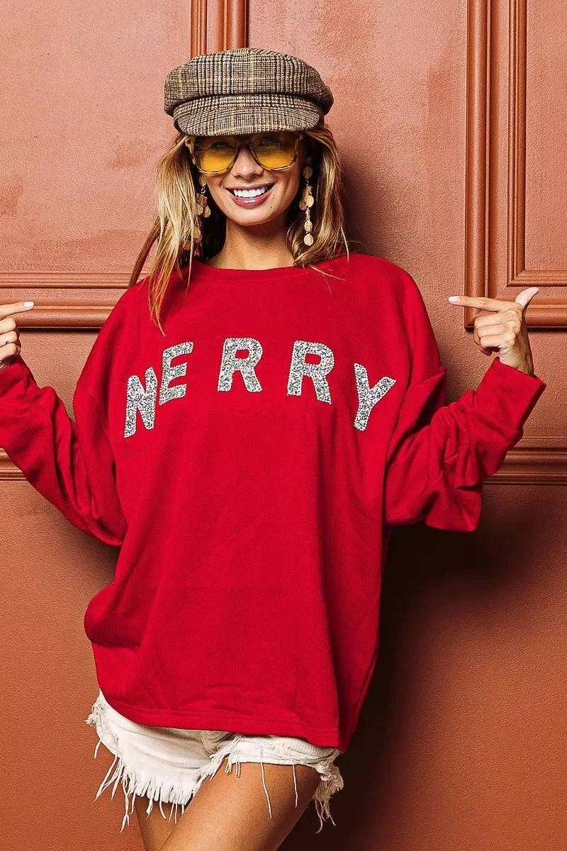 BiBi Merry Glitter Christmas Drop Shoulder TopThis Merry Glitter Christmas pullover is a festive and sparkly addition to your holiday wardrobe. The glitter detailing adds a touch of glamour and holiday cheer to BiBi Merry Glitter