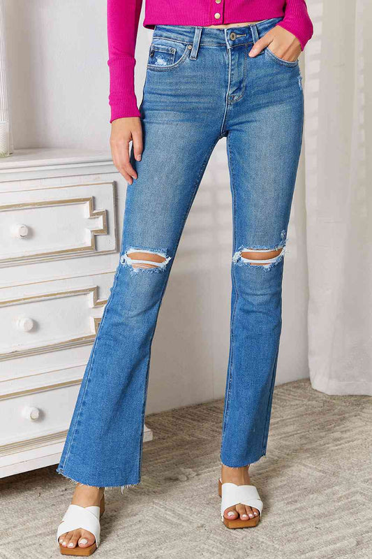 Full-size Kancan Distressed Bootcut Jeans with raw hem and ripped knees in blue denim.