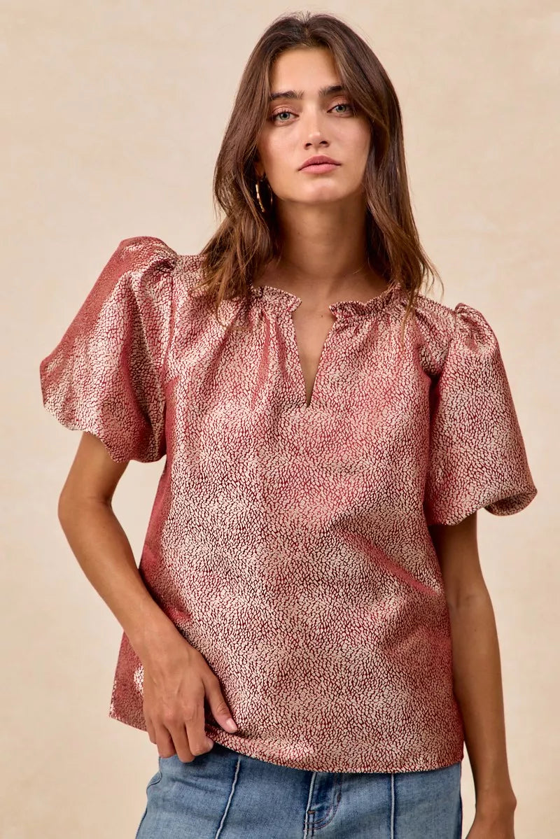 Woman wearing BiBi Jacquard Woven short balloon sleeve V neck top in patterned fabric