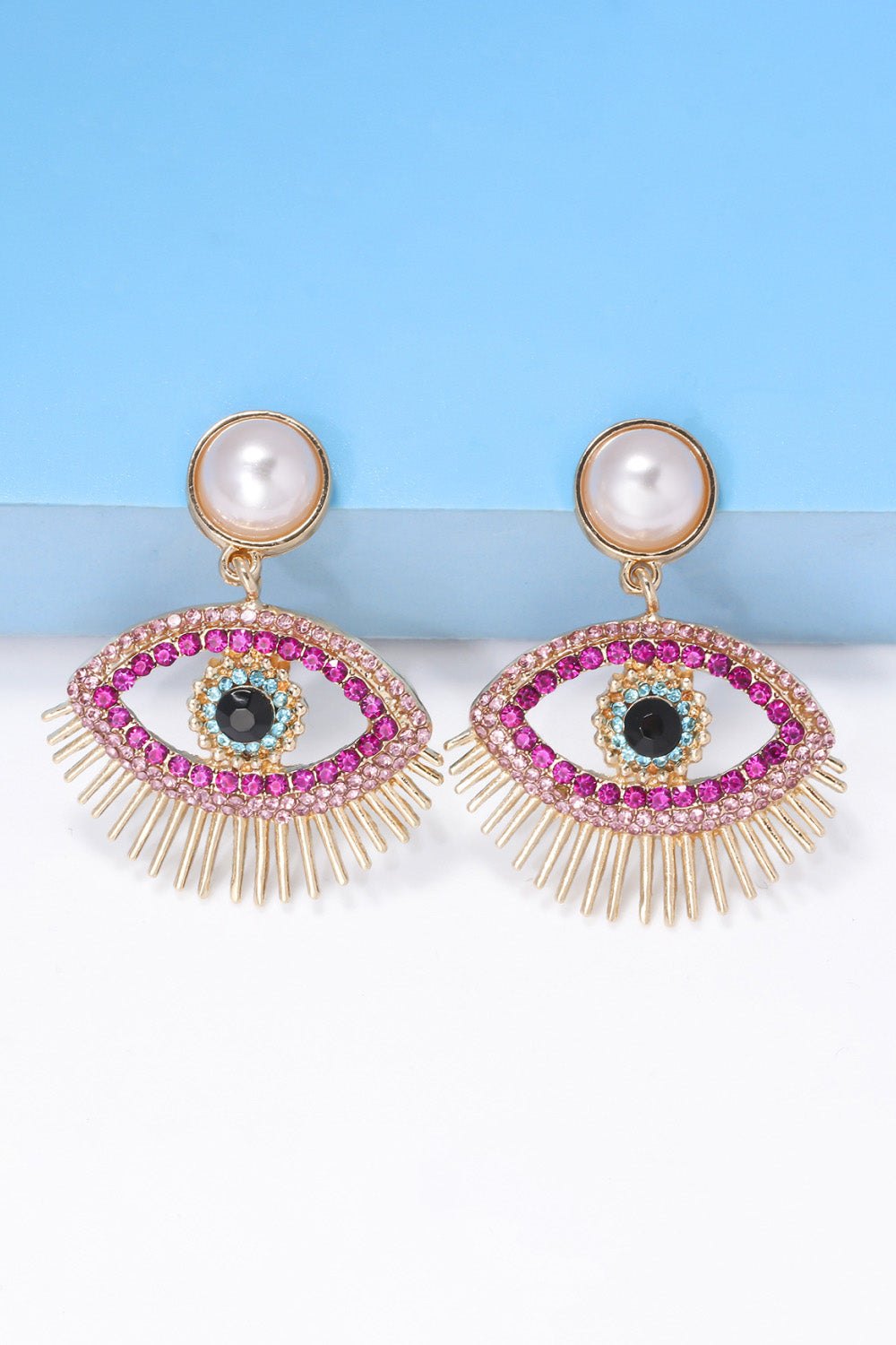 Evil eye shape rhinestone dangle earrings with synthetic pearl and gold zinc alloy detailing
