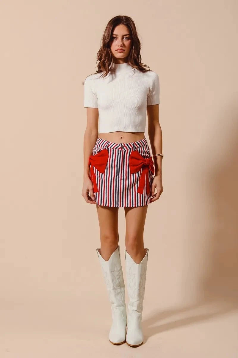 SO ME Contrast Bow Knot Pocket Fourth Of July Denim SkirtThis stylish striped denim mini skirt features a charming nautical-inspired design with bold red and white vertical stripes. Crafted from lightweight denim material,Redemption By Ashley NorthContrast Bow Knot