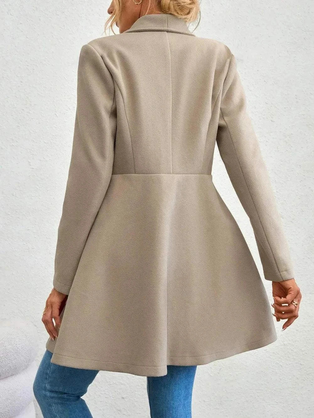 beige collared neck button up long sleeve coat with flared hem back view