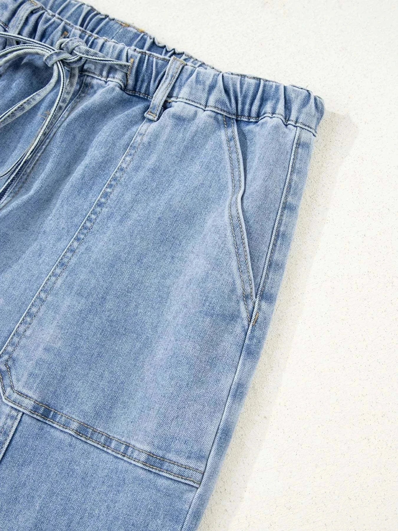 Wide Leg Drawstring Raw Hem JeansFeatures:Pocketed,Drawstring
Stretch:Slightly stretchy
Material composition:75% cotton, 23% polyester, 2% elastane
Care instructions:Machine wash cold. Tumble dry loRedemption By Ashley NorthWide Leg Drawstring Jeans