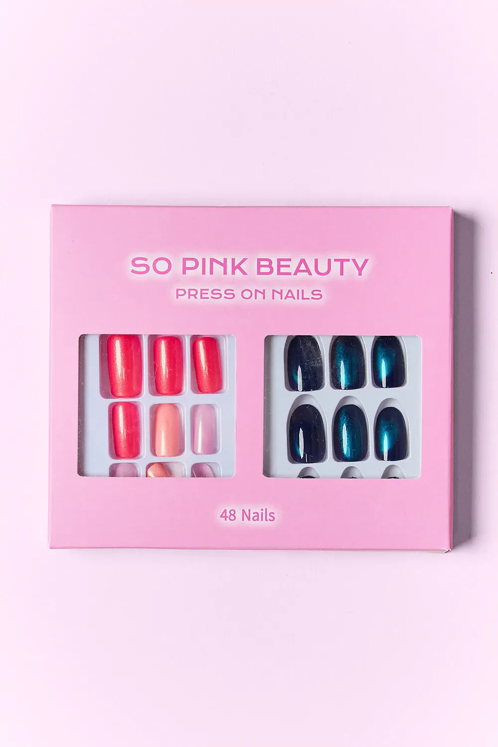 So Pink Beauty Press On Nails two packs with red and blue nail designs and glue included in pink packaging