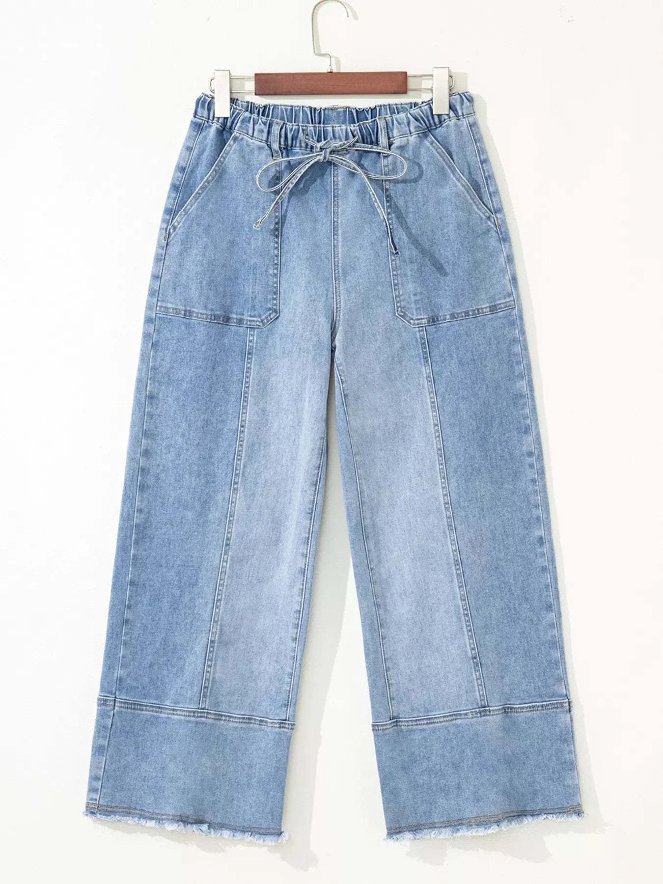 Wide Leg Drawstring Raw Hem JeansFeatures:Pocketed,Drawstring
Stretch:Slightly stretchy
Material composition:75% cotton, 23% polyester, 2% elastane
Care instructions:Machine wash cold. Tumble dry loRedemption By Ashley NorthWide Leg Drawstring Jeans