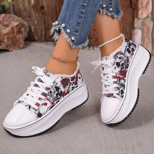 white and black printed platform sneakers with floral and skull design, lace-up style, worn with pearl-embellished frayed hem jeans