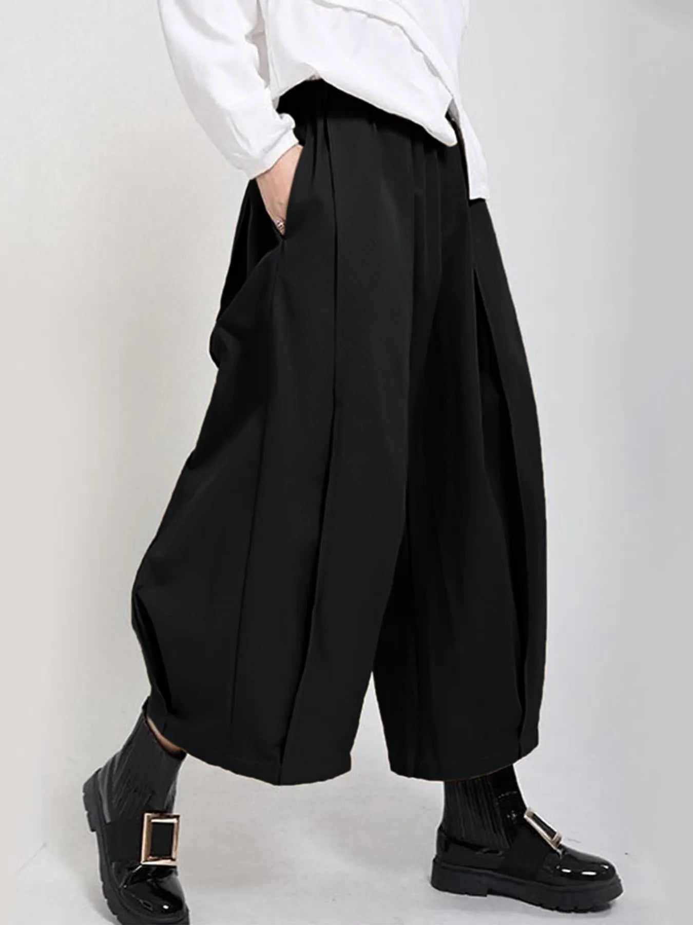 Plus Size Pleated Cropped Pants with Wide Leg Detail.