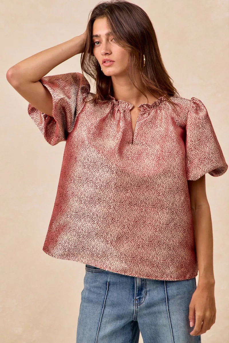 Women wearing BiBi Jacquard Woven short balloon sleeves V neck top in pink textured fabric.