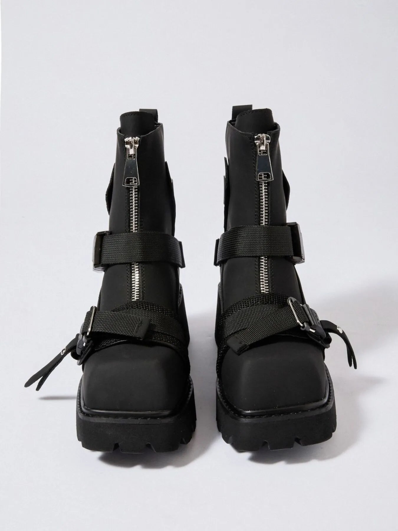 Chunky Platform Boots with Buckle Straps and Front Zip - Stylish Footwear for Every Occasion.