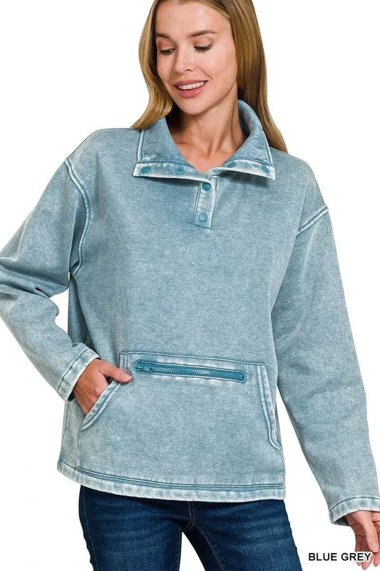 Woman wearing blue grey fleece washed high neck kangaroo pocket sweatshirt