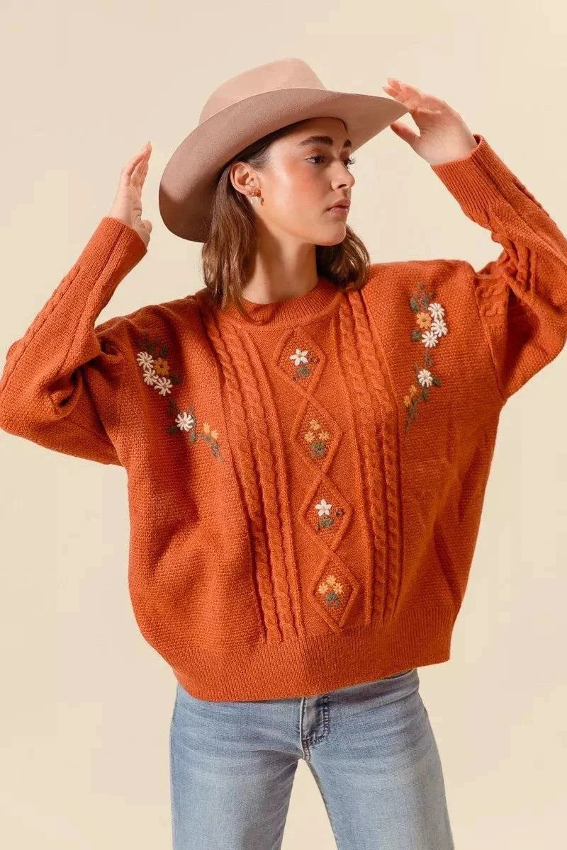 SO ME Embroidered Flower Cable Knitted SweaterElevate your winter wardrobe with this charming embroidered flower cable knitted sweater. The intricate floral embroidery adds a delicate and feminine touch to the cRedemption By Ashley NorthEmbroidered Flower Cable