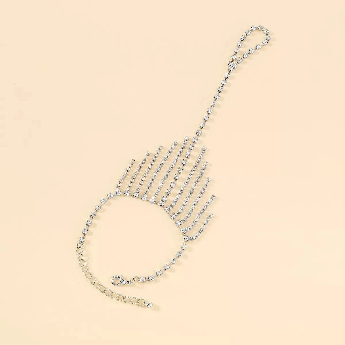 Rhinestone Fringe Hand Chain BraceletPieces:1-piece
Material:18K Gold-Plated,Iron,Rhinestone,Silver-plated
Care instructions:Avoid wearing during exercise, as sweat will react with the jewelry to producRhinestone Fringe Hand Chain