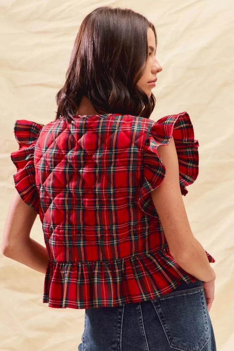 Women wearing red Christmas holiday plaid ruffled quilt vest top with tied shoulder straps and peplum hem