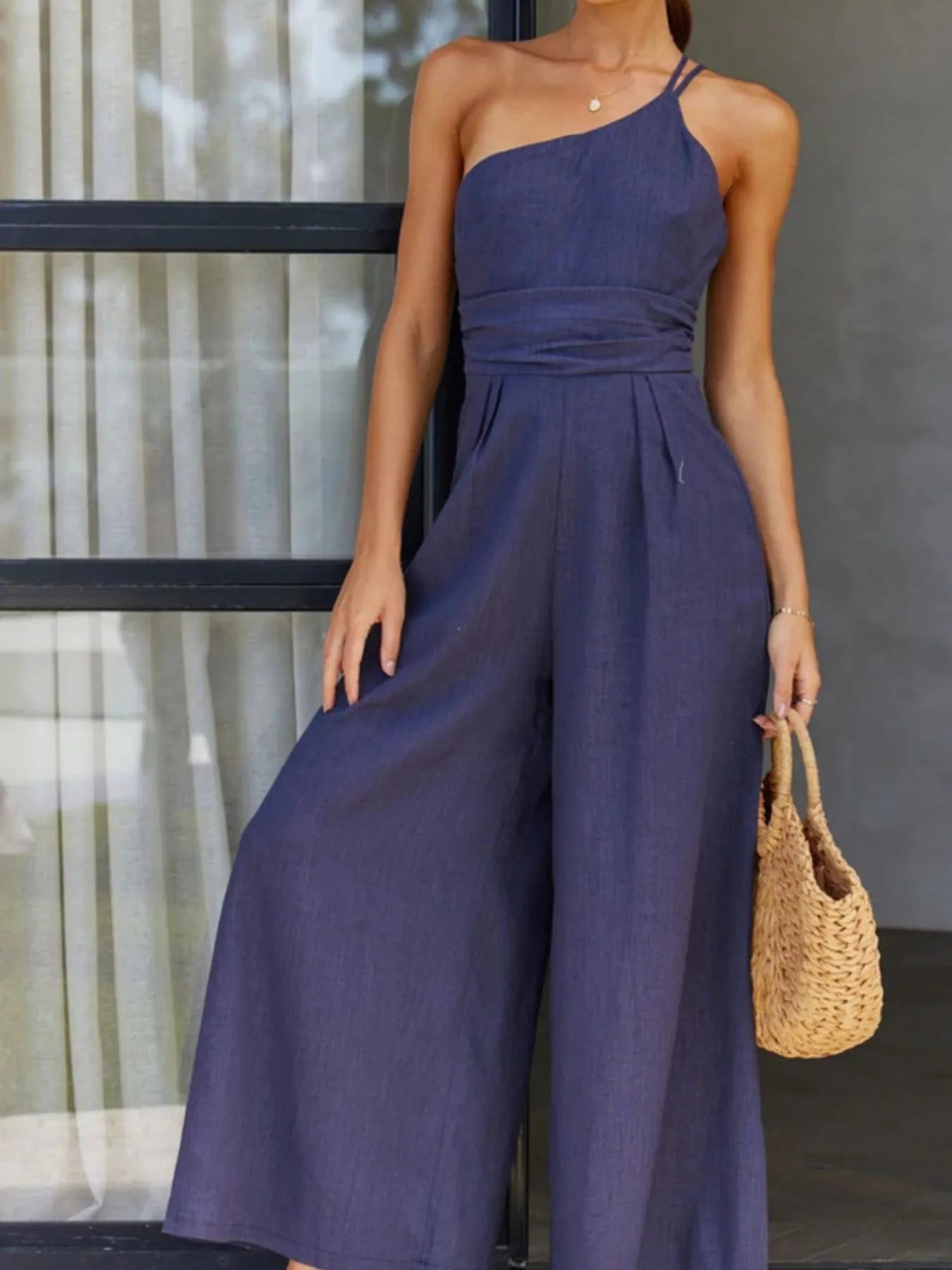 Single Shoulder Jumpsuit with Wide Leg Design.