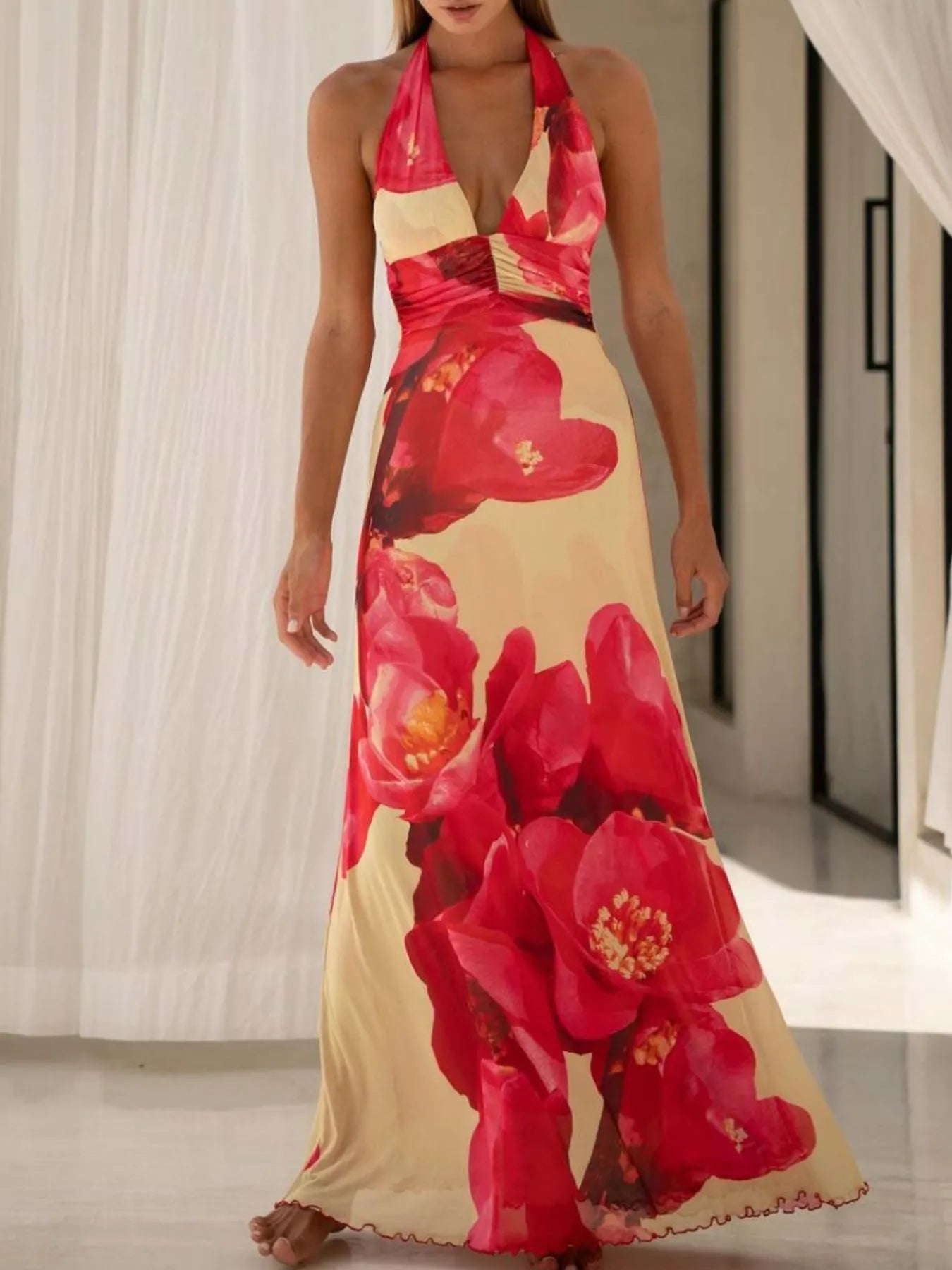 Floral Maxi Dress with Halter Neck and Deep V Design.