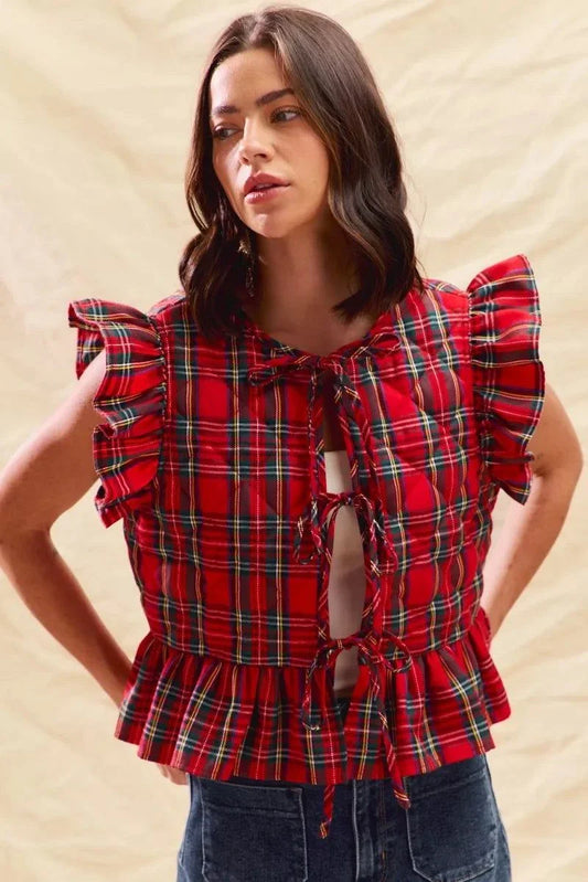 Woman wearing Christmas holiday plaid ruffled quilt vest top with tie front and ruffled sleeves