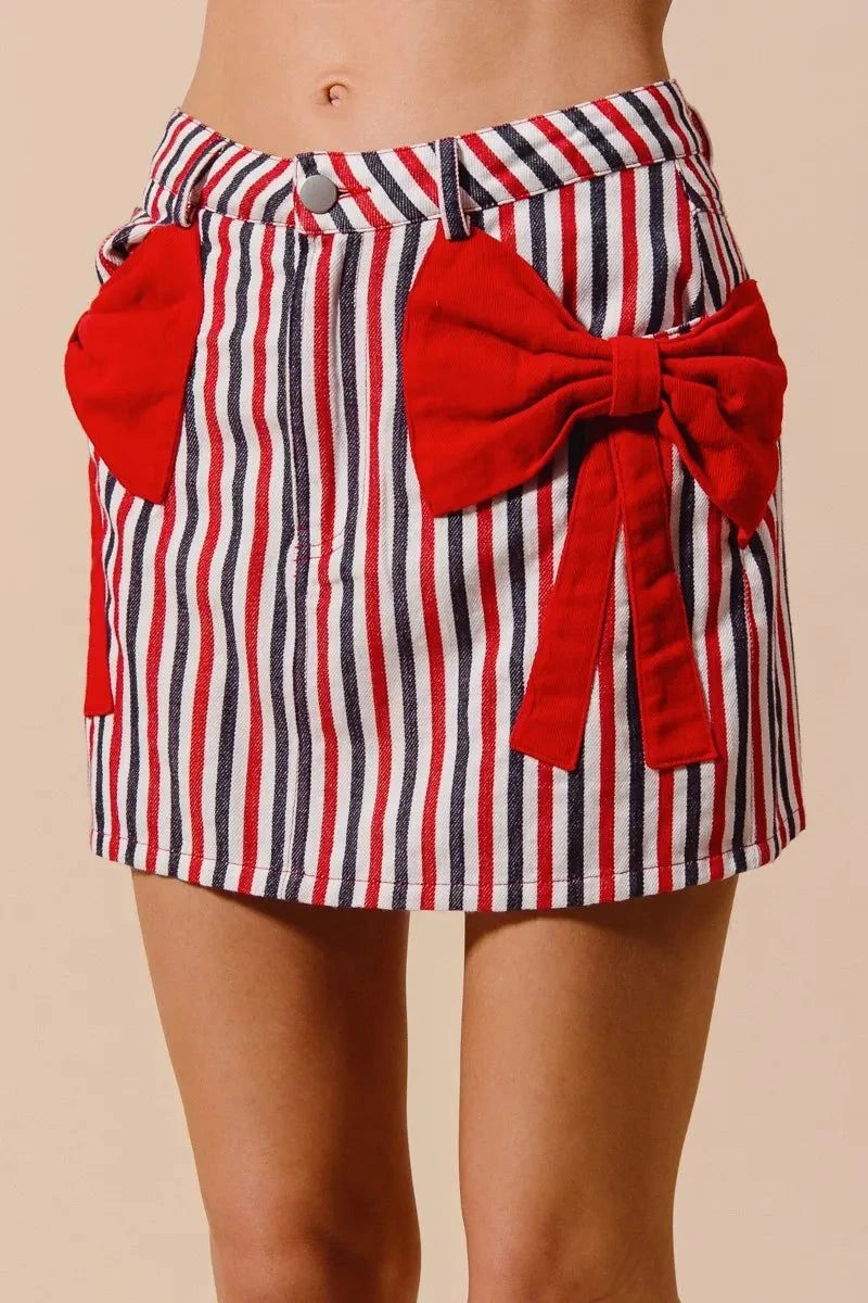 SO ME Contrast Bow Knot Pocket Fourth Of July Denim SkirtThis stylish striped denim mini skirt features a charming nautical-inspired design with bold red and white vertical stripes. Crafted from lightweight denim material,Redemption By Ashley NorthContrast Bow Knot