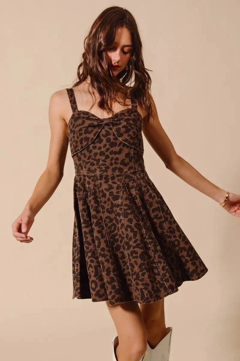 Woman wearing SO ME mineral washed leopard flare cami dress with adjustable straps and flared skirt