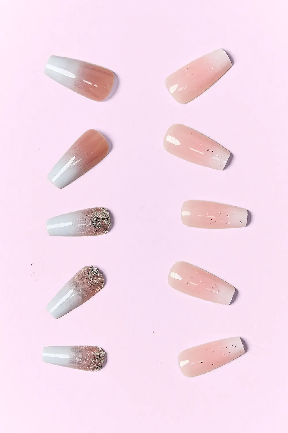 So Pink Beauty press on nails two packs with neutral tones and glitter accents on pink background