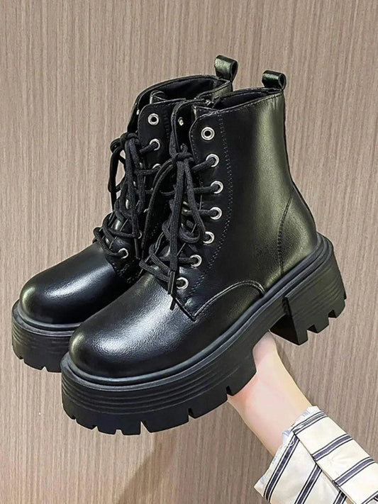 Black platform lace up boots with chunky soles for stylish comfort and durability