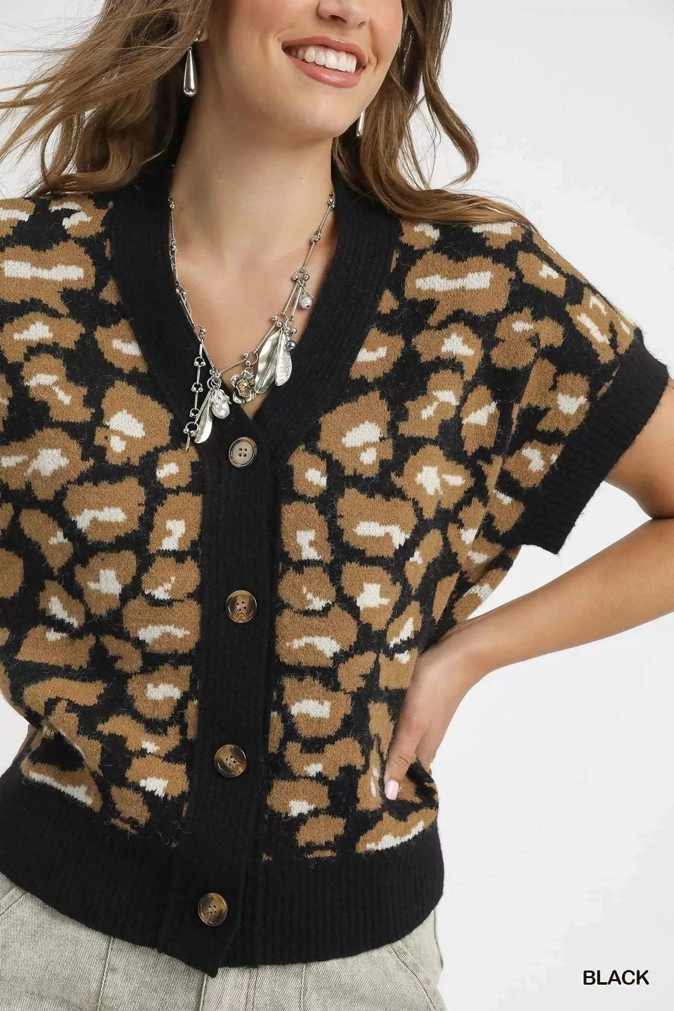 Umgee Leopard Button Down Short Sleeve CardiganThis stylish leopard print cardigan combines comfort and fashion with its eye-catching animal print pattern and classic button-up design. Made from soft knit materiaRedemption By Ashley NorthUmgee Leopard Button Down