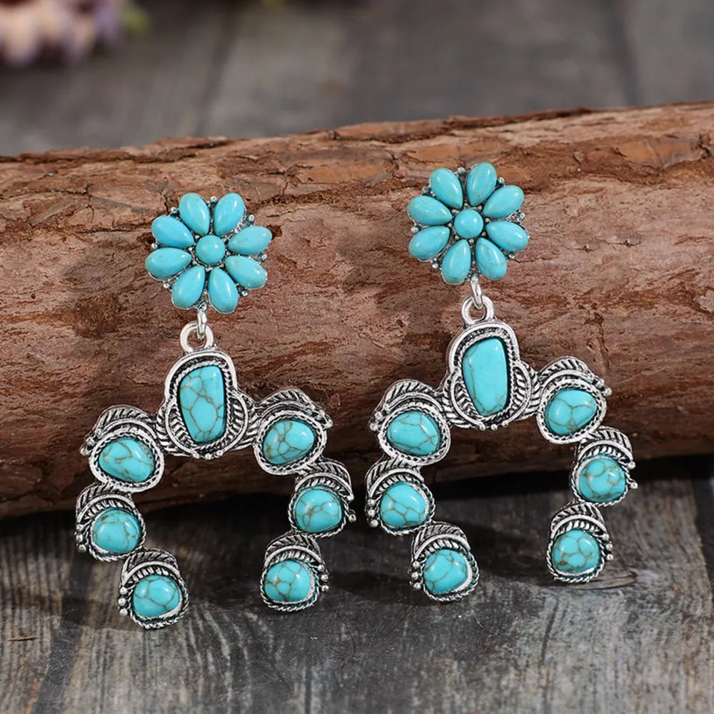 Artificial turquoise alloy dangle earrings with floral design and silver detailing