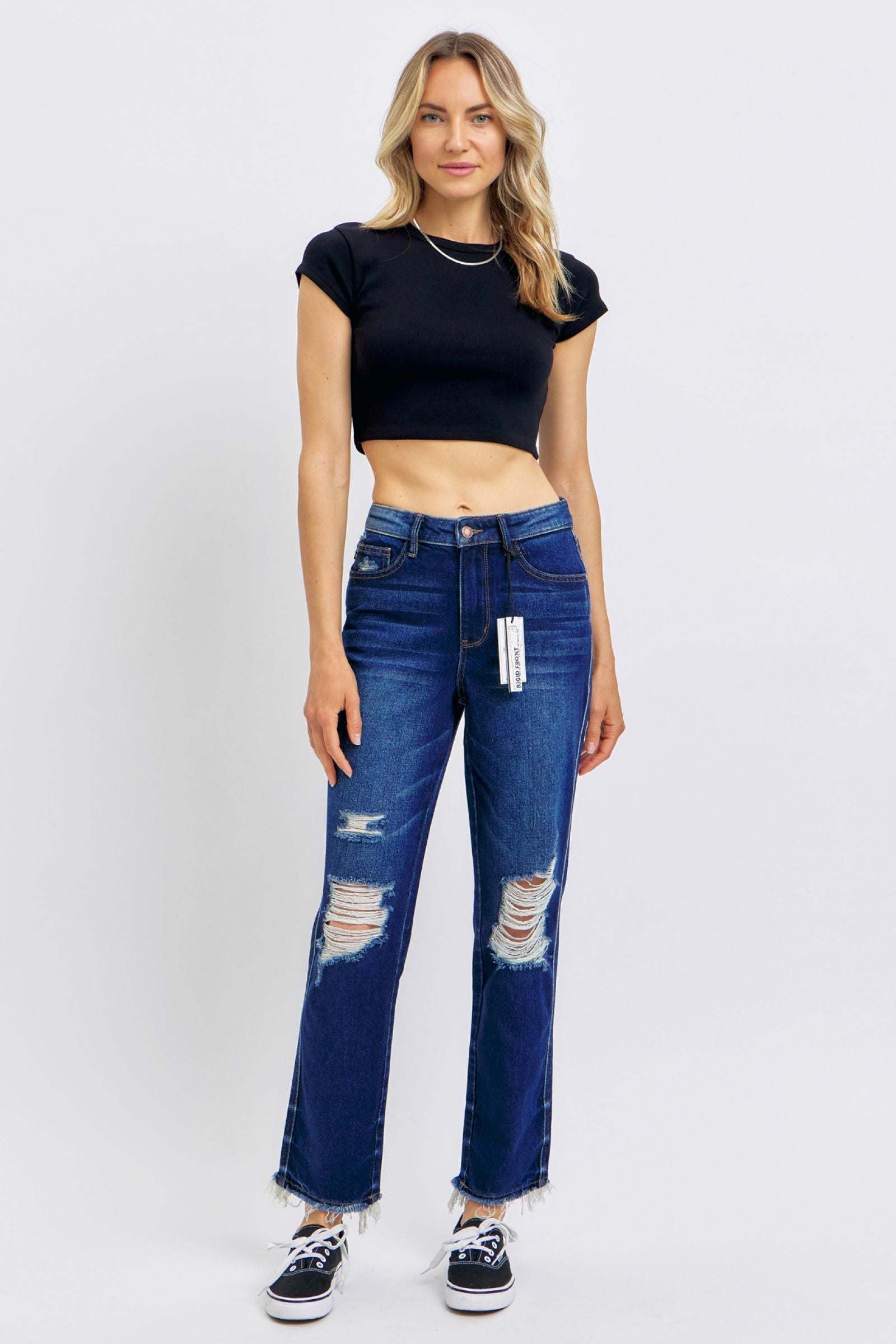 Woman wearing Judy Blue High Waist Rigid Jeans with heavy destroy straight style and black crop top