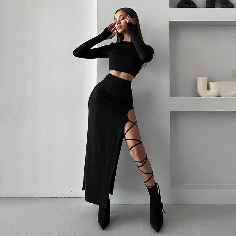 Woman wearing a solid color slim fit tie skirt set with long sleeve round neck top and lace-up detail on skirt slit